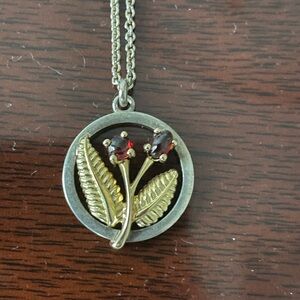 Sterling silver and  18 k gold necklace with 2 garnets 18 inches long